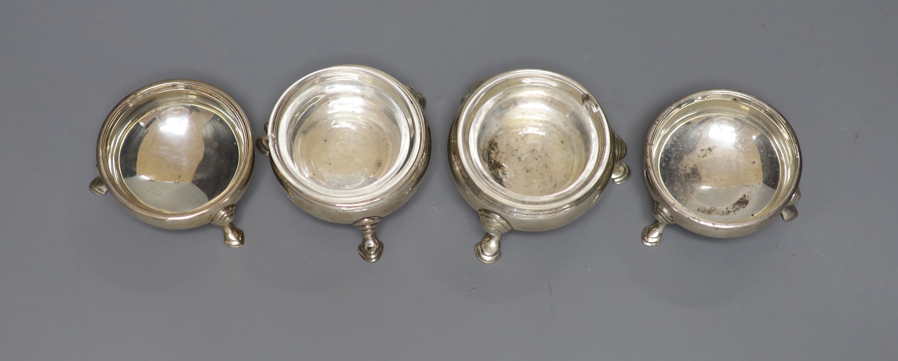 Two George III silver bun salts and a pair of later salts.